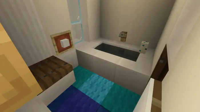 Compact bathroom with tub and blue rug