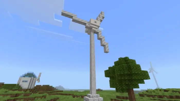 Blocky wind turbine and dome structure in field