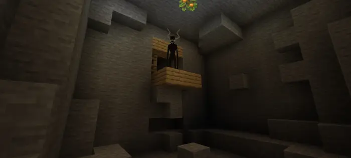 Horned creature stands on wooden platform in cave.