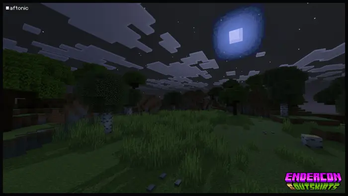 Open grassy field under a glowing night sky