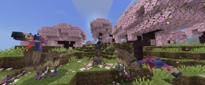 Dinosaurs roam under pink blossom trees