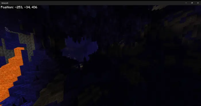 Dark underground cave with glowing lava flow.