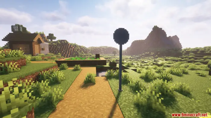 ALT Road sign beside a dirt path in blocky landscape
