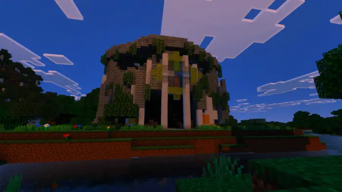 Modern dome structure with lush greenery
