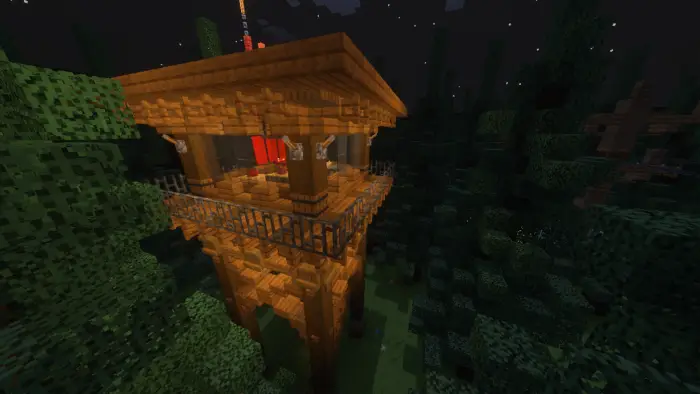 Wooden watchtower in a dark, dense forest