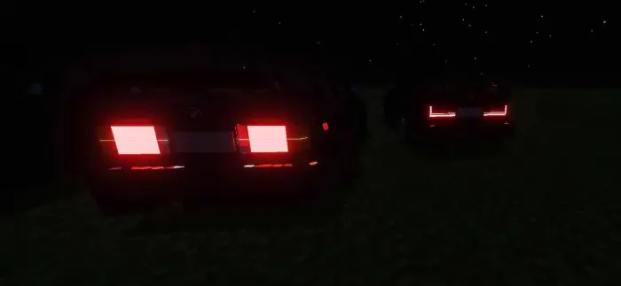Two custom cars with glowing red taillights