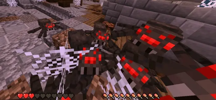 Pixelated red-eyed spiders swarm in-game.