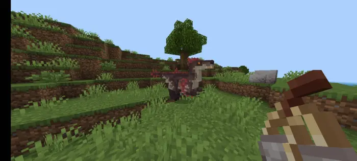 Blocky dinosaurs roaming grassy hills