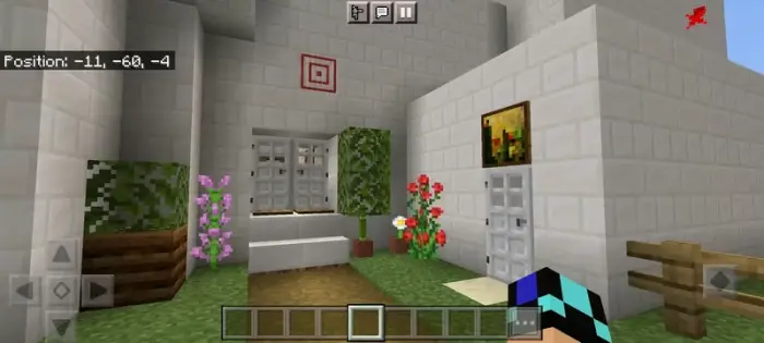 White building with flowers and iron doors