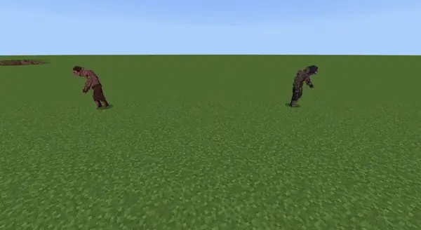 Two zombies walking on a grassy field.