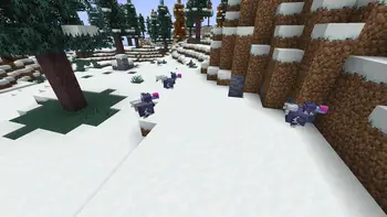 Four icy mobs roam a snowy hillside.