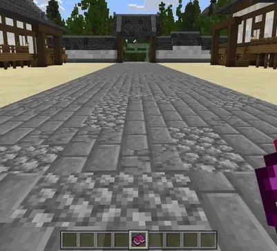 Stone courtyard with a player holding a book