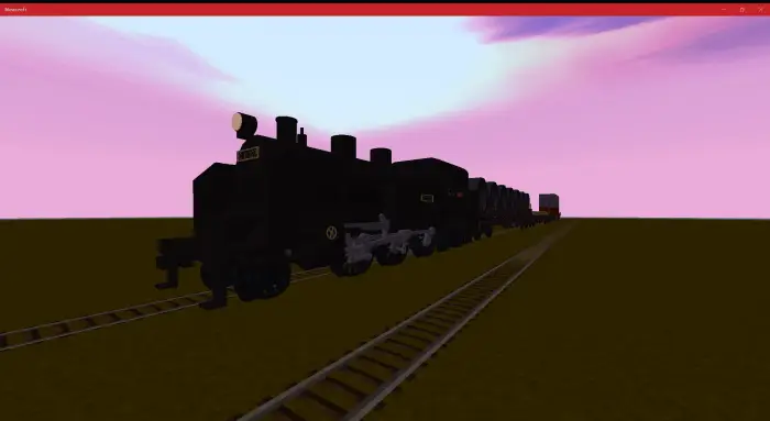Blocky black steam locomotive on train tracks