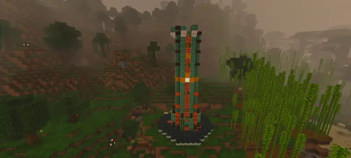 Dark, misty landscape with a tall tower