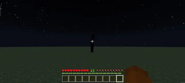 Dark, eerie creature stands under night sky