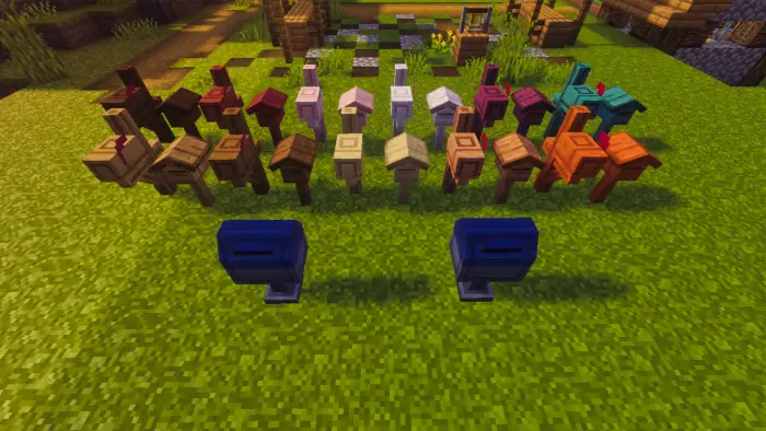 Colorful wooden mailboxes on grass.