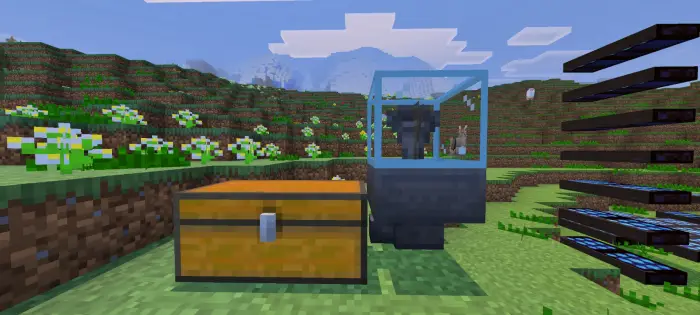 Chest and automated machine on grassy field