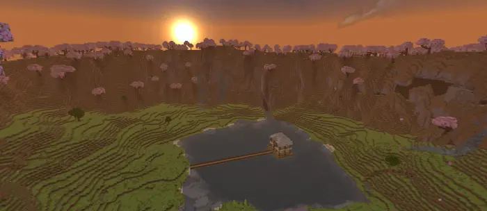 Spruce house on island in mountain lake at sunset