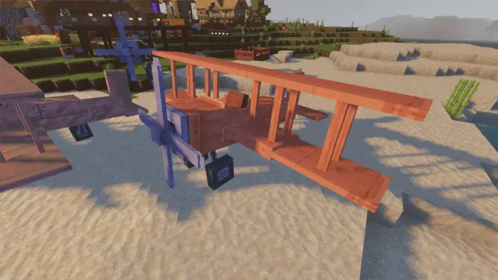 Wooden and copper biplanes on a sandy shore