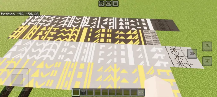 Various road markings and textures on grass.