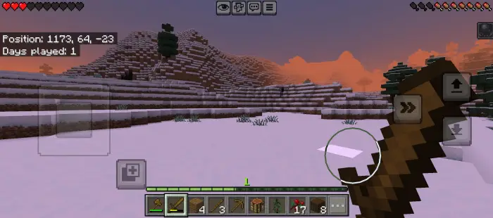 Snowy landscape at sunset, player holds sword