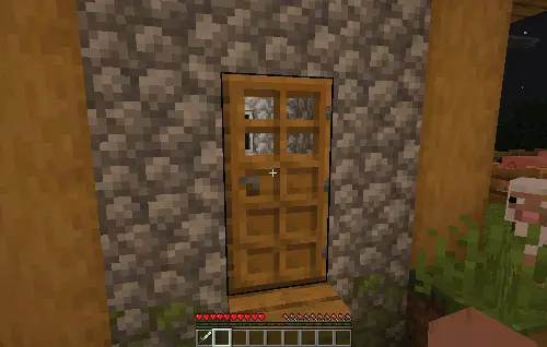 Wooden door on a stone house at night