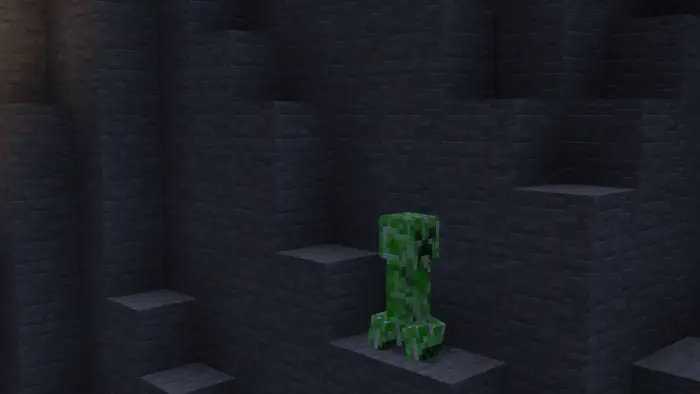 Green creature on detailed stone steps