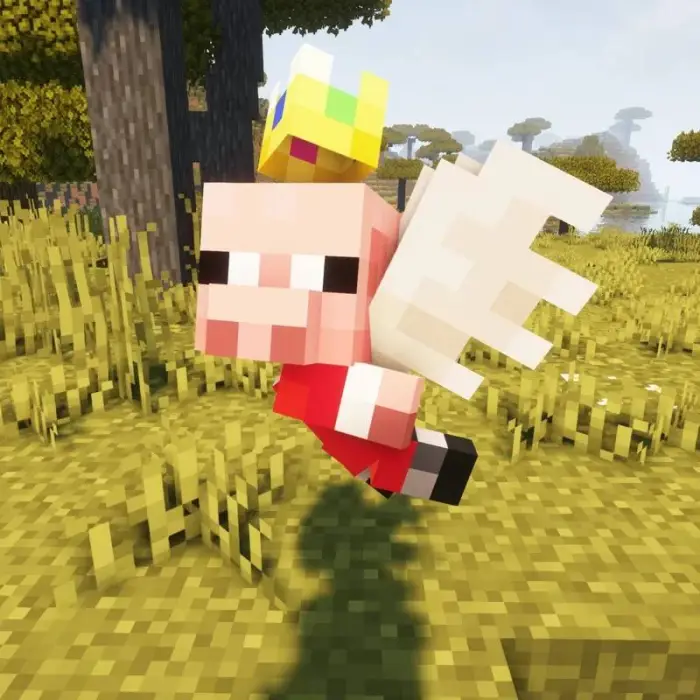 Pixel pig with wings and a crown in field