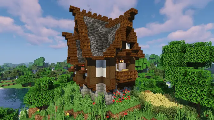 Medieval rustic cottage on grassy hillside