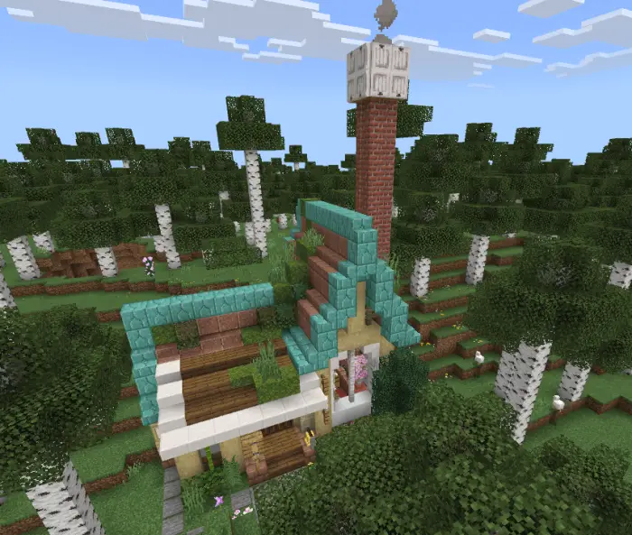 Cottage with teal roof in birch forest