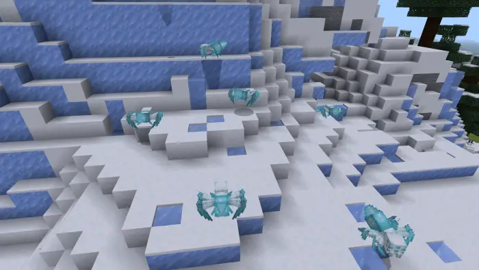 Icy spiders crawl on a snowy mountain.