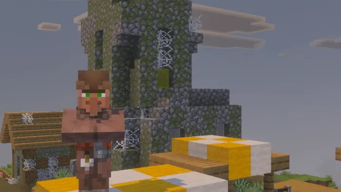 Villager with textured stone tower and webs