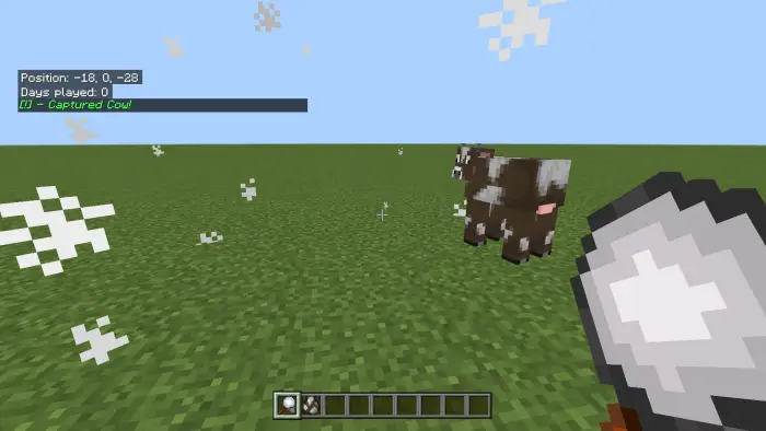 Player uses mob capture tool near cows
