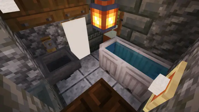 Small cozy bathroom with tub and lantern