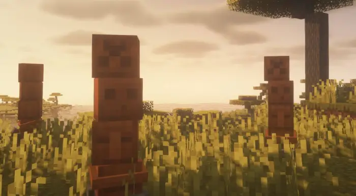 Blocky biome-themed creepers in tall grass