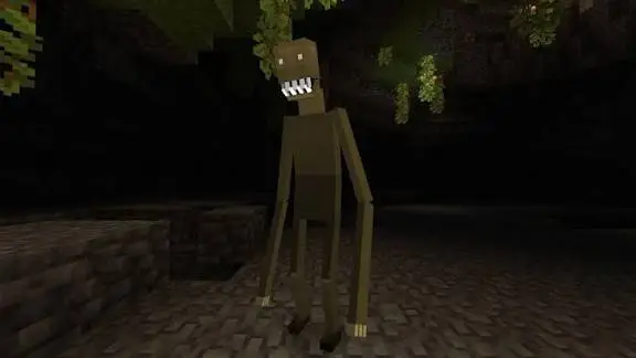 Creepy tall creature in a dark cave