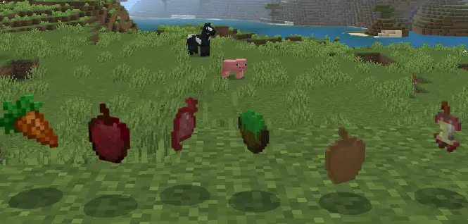 Animals and food items on grassy terrain