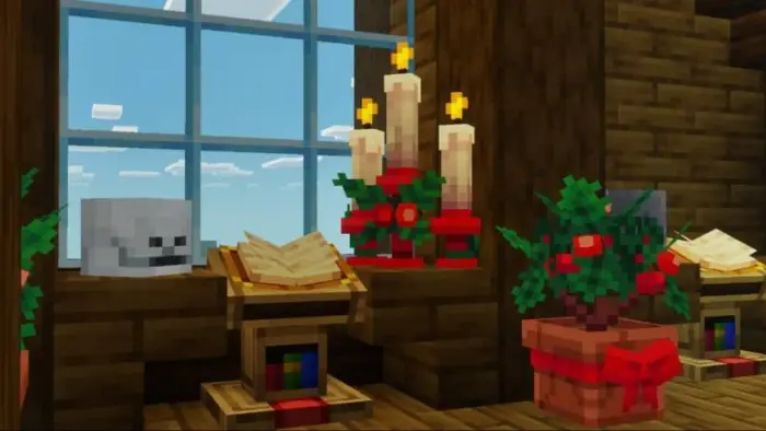 Festive candles and plants by a window