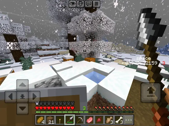 Snowy forest scene with player holding axe.