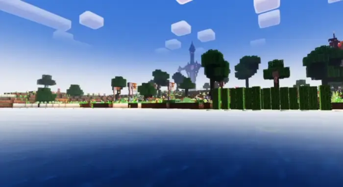 Bright landscape with water, trees, and castle