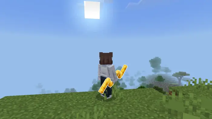 Player holding glowing golden fantasy weapons