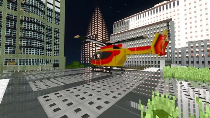 Red and yellow helicopter on rooftop helipad