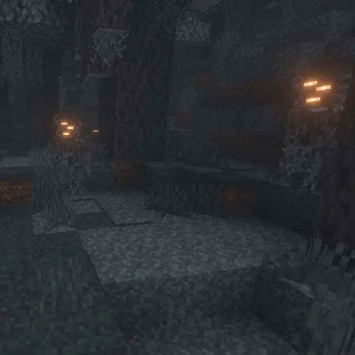 Dimly lit rocky forest with glowing plants