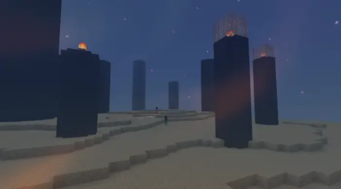 Moody towers with glowing lights at dusk