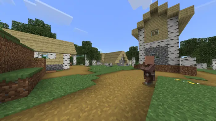A villager walks through a birch village.