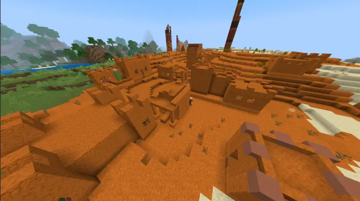 Mesa village structures in a red sand biome
