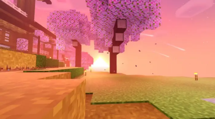 Blocky landscape with pink trees at sunset.