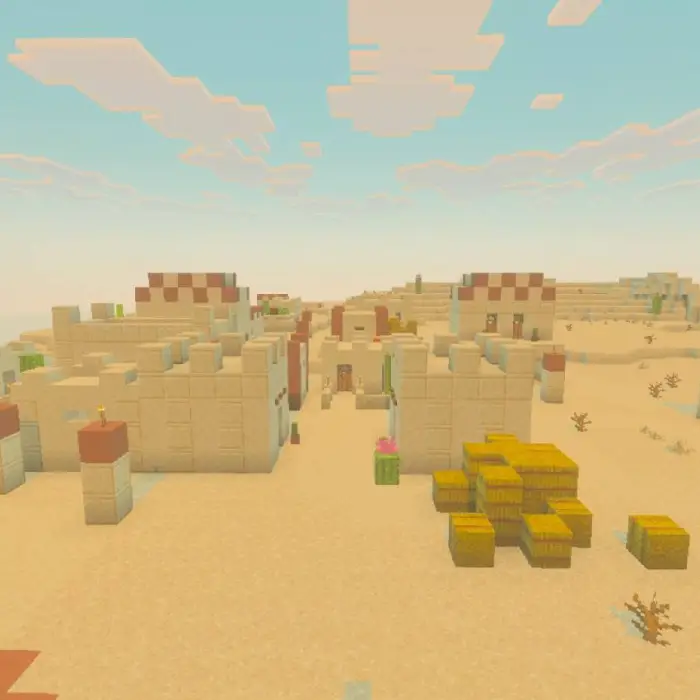 Desert village with sandstone houses and hay.