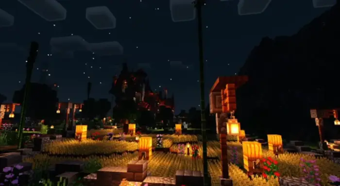 Glowing lanterns light up a night village.