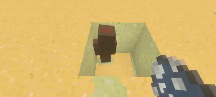 Brown creature in a sand pit with spawn egg